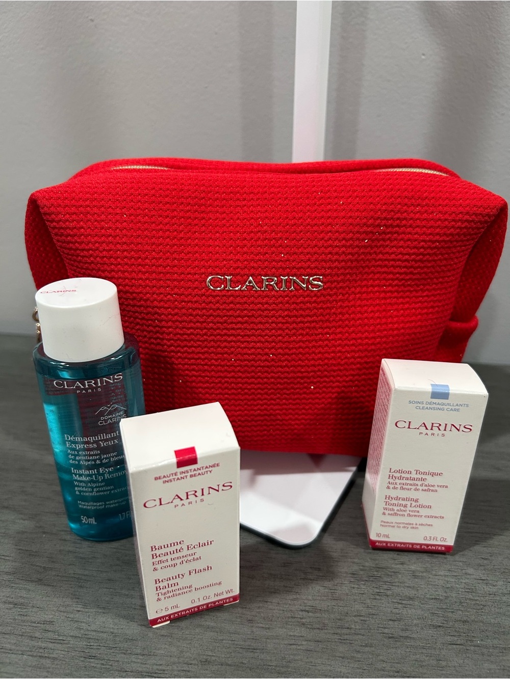 Clarins Red Travel Cosmetic Bag and skincare set